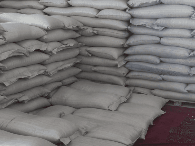 Stacked sacks of graded produce in a storage warehouse